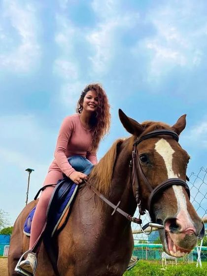 A happy rider and an equally happy-looking horse. This photo perfectly captures the joy of riding.