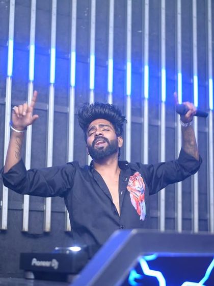 Singing along with the crowd at Carpediem Hyderabad. It's not just about playing tracks; it's about creating a collective vocal performance.