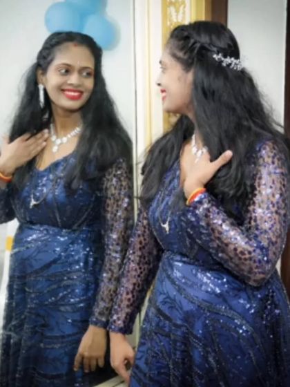 This beaded navy blue gown with detachable sleeves is a versatile option for a birthday or anniversary party. Rent it for a glamorous look without the commitment.