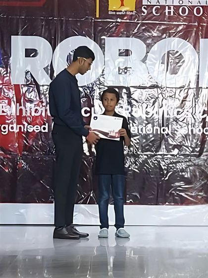 A young Roboprenr receives his 3rd place certificate at the RoboEra’25 Sumo Robotics event. We encourage participation in various competitions to give students diverse platforms to test their skills.