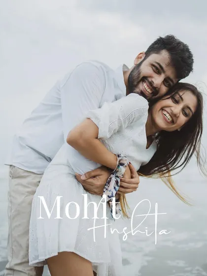 A happy, natural portrait of a couple embracing on the beach. Our pre-wedding shoots are about capturing your genuine smiles and connection.