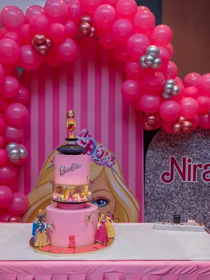 A close-up of the spectacular Barbie cake, featuring a rotating Barbie doll and a sparkling pink design.
