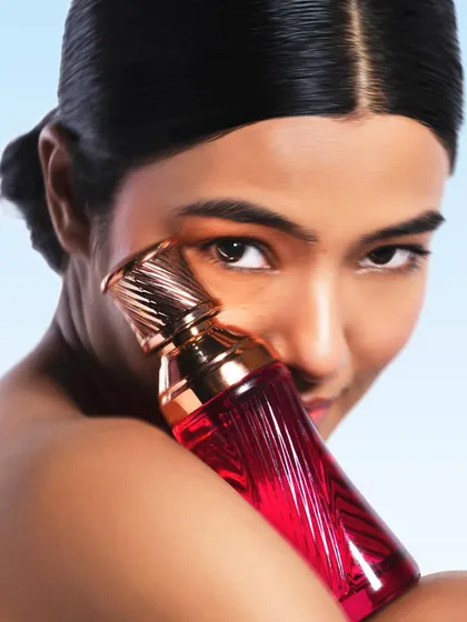 A crisper version from the fragrance series. This image provides a clear, high-definition look at the product bottle and the model's serene expression.