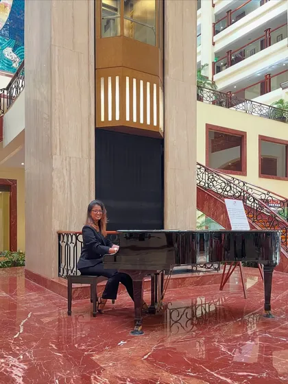Before the beats and the bass, there was the melody. Pictured here at a grand piano, this image reflects the musical foundation that underpins all my production work, from complex electronic tracks to soulful reprises.