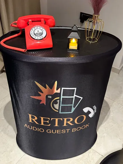 My podium setup is a simple and stylish way to capture memories. It includes a classic retro phone on a branded stand, making it a compact option that fits perfectly into any event space.