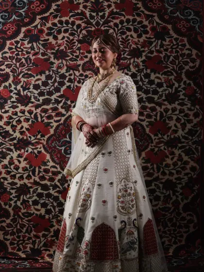 A full-length view of a stunning bridal lehenga. My job extends to ensuring the entire look is cohesive, from the makeup and hair to the way the dupatta is draped, creating a picture-perfect silhouette.