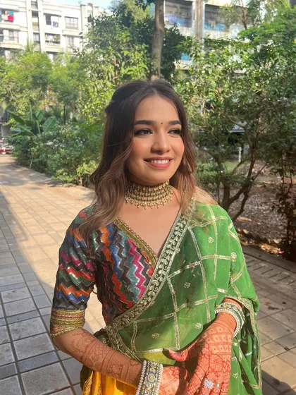 A beautiful candid shot of the bride, her makeup glowing in the sunlight.