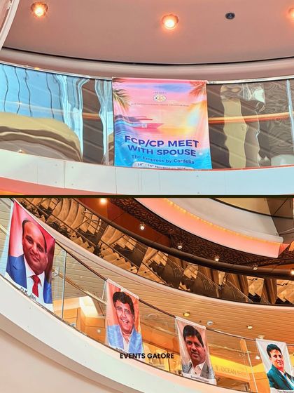 Multi-level branding inside the cruise ship's atrium. I utilized the vertical space to hang banners with event branding and photos, ensuring visibility across different floors.