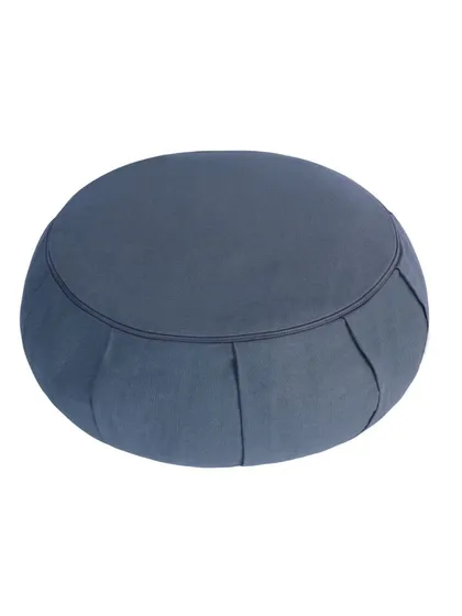 An angled side view of the blue-grey zafu, showing its pleated construction.