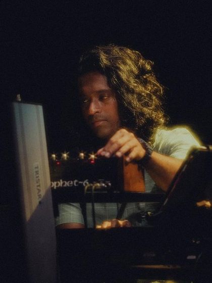 The talented Vivek Santhosh on keys during the 'Vari' album release concert. His melodic improvisations and harmonic support are essential to our sound.