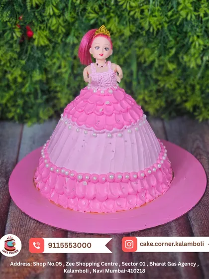 A beautiful pink princess doll cake, where the cake itself forms the gown. Decorated with pearls and ruffles, it's a classic and elegant choice for a birthday girl.