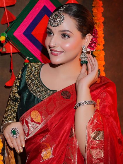 An entire Diwali-themed shoot featuring our red Banarasi saree. This series shows a complete concept, from decor to final look, providing rich inspiration for festive content.