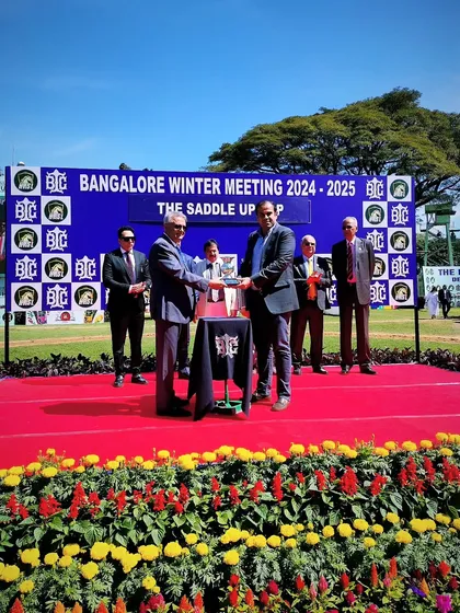 Presenting the Saddle Up Cup trophy.