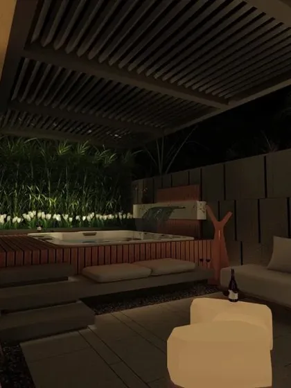 A night view of a private patio for a hotel suite in Ludhiana. The design features a luxurious jacuzzi, comfortable lounge seating under a pergola, and soft, ambient lighting to create a sophisticated and relaxing atmosphere.