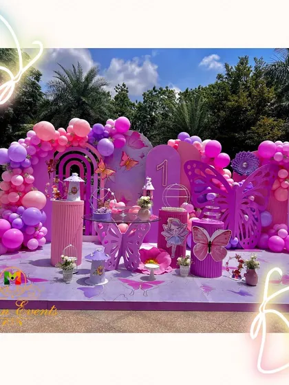 A first birthday should be pure magic. I brought this butterfly theme to life with a vibrant pastel palette, custom props, and a sea of balloons, creating an enchanting outdoor wonderland for a very special little girl.