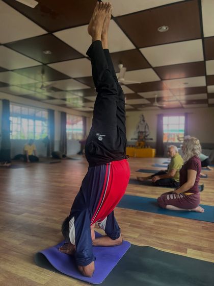 Even as a teacher, I am always a student. Here I am practicing Vrischikasana, constantly refining my own connection to the practice.