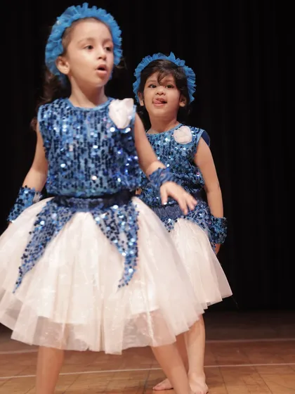 A great shot of our 'Dancing Rockets' performing together. We teach them how to dance as a cohesive unit, creating a visually stunning group performance.