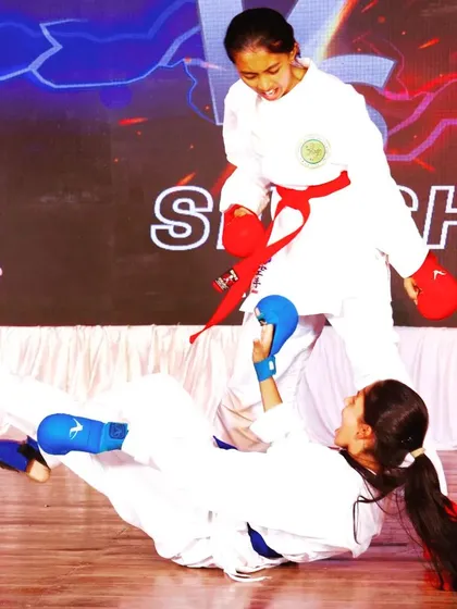 In our Kumite sessions, girls learn to react under pressure and apply their skills effectively. This action shot from a sparring match demonstrates the practical and dynamic nature of our self-defense training for women.