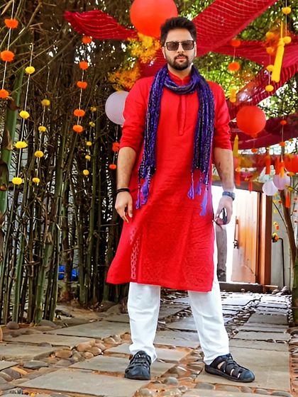 Dressed for the occasion at a Haldi ceremony. Rocking a red kurta to bring the right vibes for the daytime festivities. It's all about matching the energy of the event, from the music to the look.