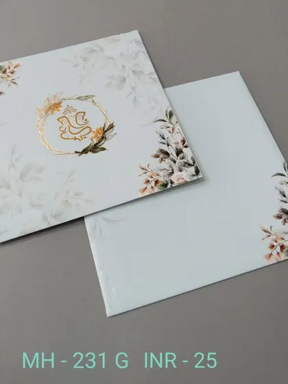 This modern floral invitation features a gold-foiled Ganesha in a geometric frame. It's a stylish blend of contemporary design and traditional blessings.