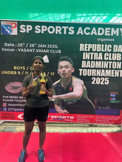 The U13 girls' runner-up, Mita Bhat, with her well-earned awards.