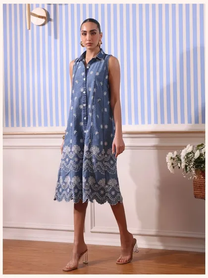 Yes, I really made a denim dress. This sleeveless denim shirt dress is embroidered with a delicate white pattern for a unique fusion look.