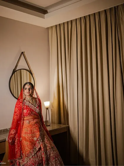 A stunning bridal portrait of Saloni on her wedding day. I captured her in a quiet moment of reflection, the soft lighting highlighting her elegant attire and calm demeanor.