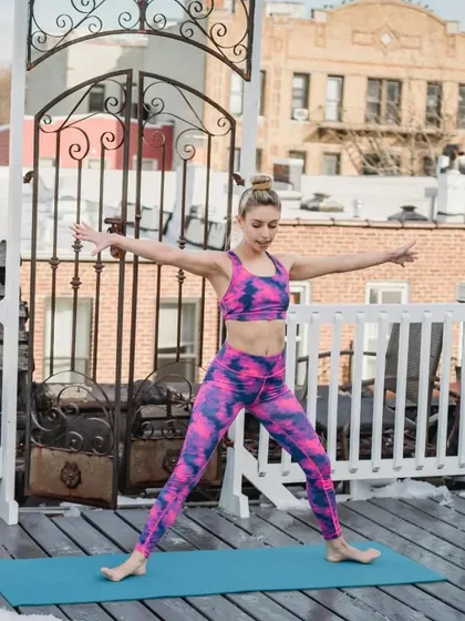 A look at Tadasana (Mountain Pose). The caption explains how to achieve good alignment by rooting the feet and lengthening the spine.