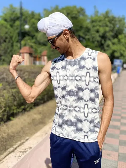 A simple moment of flexing after a workout. It's not about vanity; it's about acknowledging the results of hard work and staying motivated for the unending game.