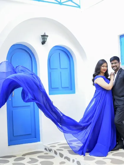 Another stunning shot showcasing the flowing blue gown. We use fabric to add movement and drama to your pre-wedding photos.