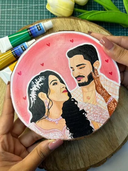 A detailed shot of a romantic couple portrait on a small wooden slice. I paid special attention to the henna details on her hand and the loving expression between the couple.