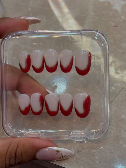 This modern French tip design with a bold red abstract curve is another style we explore in the workshop. It shows how you can play with classic concepts to create something fresh and eye-catching.