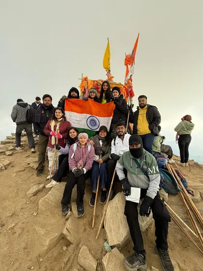 Another angle of our triumphant group at the Chandrashila peak. The feeling of community and success is what makes these trips special.