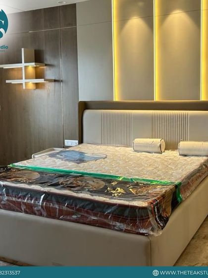 A full view of the modern beige bed and matching side table, showing how the pieces create a serene and stylish bedroom retreat.