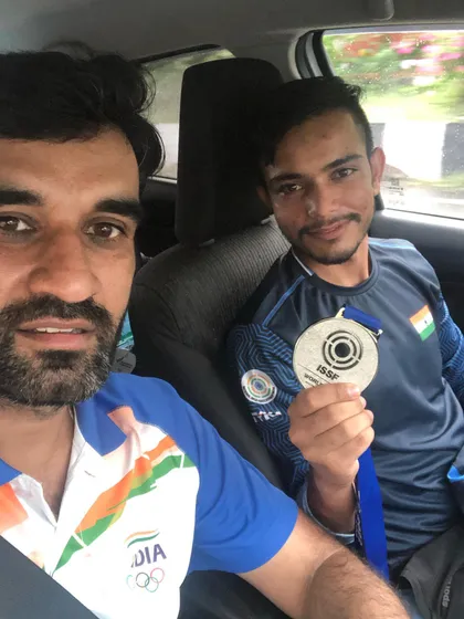 Celebrating a silver medal win at the ISSF World Cup in South Korea. International success is a journey we take together.