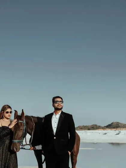 Adding a horse to the scene brings a touch of rustic elegance and a dynamic element to this modern pre-wedding shoot.