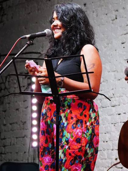 A happy moment during a solo performance. I love interacting with the audience, sharing stories behind the songs, and making everyone feel like part of the show.
