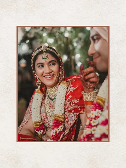 A happy, candid moment of the bride during her Indian wedding ceremony in London. We create an environment where couples can feel relaxed and joyful on their big day.