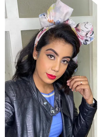 I love recreating iconic eras. This 90s inspired look features a classic sharp winged eyeliner and a bold red lip, perfect for a retro-themed photoshoot or anyone wanting a vintage vibe.