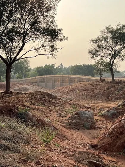 The bridge mock-up sits in the dry landscape of Aziznagar. This kind of on-site testing is critical for understanding how a structure will relate to the vast, open terrain.