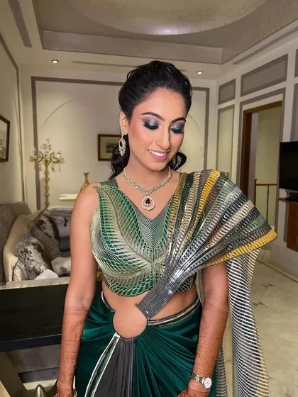 A sangeet bride glowing like a dream. This look features shimmery eyes, rosy cheeks, and the perfect pink pout, stealing hearts one look at a time.