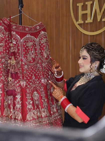 A behind-the-scenes moment of the bride getting ready. This shot, framed by the ring light, feels candid and captures the final preparations before she steps out.