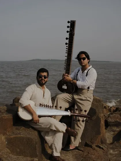 On the rocks by the sea with Pratik Shrivastava for our "Strings of Serenity" photoshoot. This image captures the blend of tradition and modern style that defines our collaboration.