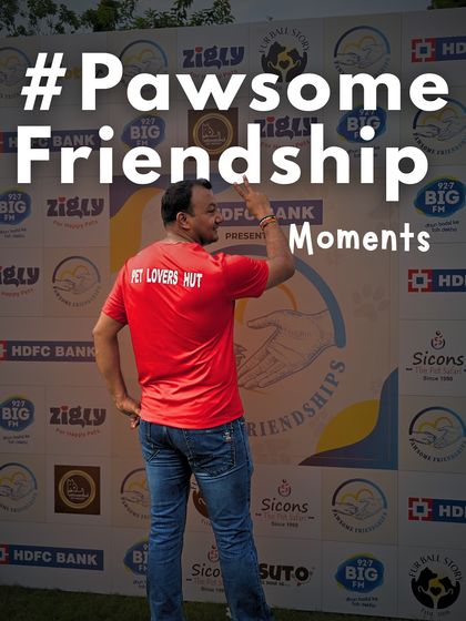 As the owner, I am always present at our events. Here I am at the photo-op wall for the 'Pawsome Friendship' event, proud to host such a wonderful gathering for the pet lover community.