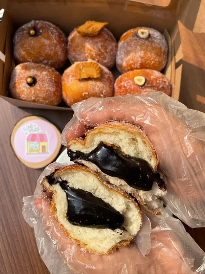 A close-up of my dark chocolate stuffed bomboloni. The rich, decadent chocolate filling is pure heaven.