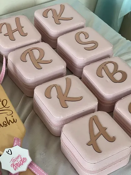 A collection of personalized jewelry boxes with custom initials for each member of the bride's squad. These are a perfect, elegant keepsake for your bridesmaids to store their treasures.