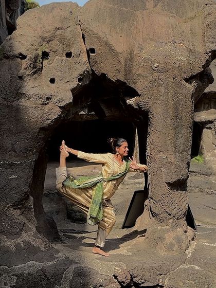A dance pose inside the ancient Ellora Caves. Wherever I go, I feel the urge to dance, especially in places with such powerful spiritual energy.
