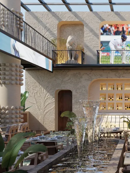 Another perspective of the grand atrium, showcasing the interplay of water, stone, and light. The elevated seating on the balcony offers a unique vantage point over the entire space.