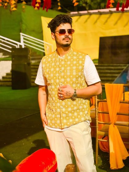 Posing during a Haldi party at BellaMonde hotels. The vibrant yellow decor and daytime energy call for a playlist full of upbeat and celebratory tracks.