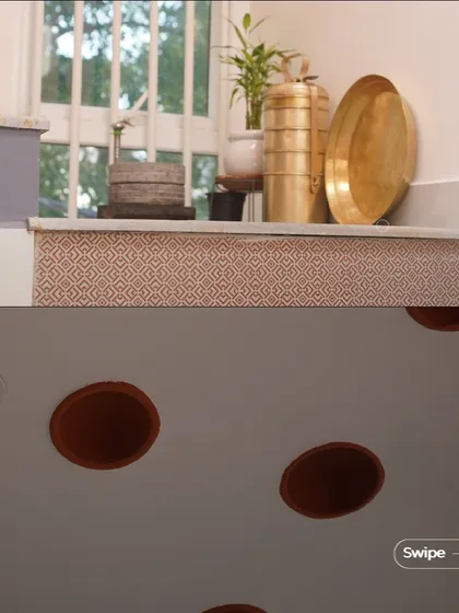 Decorative details in the Gopal Residence, including traditional brass vessels and a ceiling with inset terracotta pots, a technique used in filler slabs.